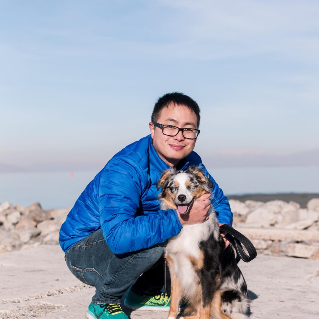 Mikey holding this dog in a chokehold while smiling for a picture