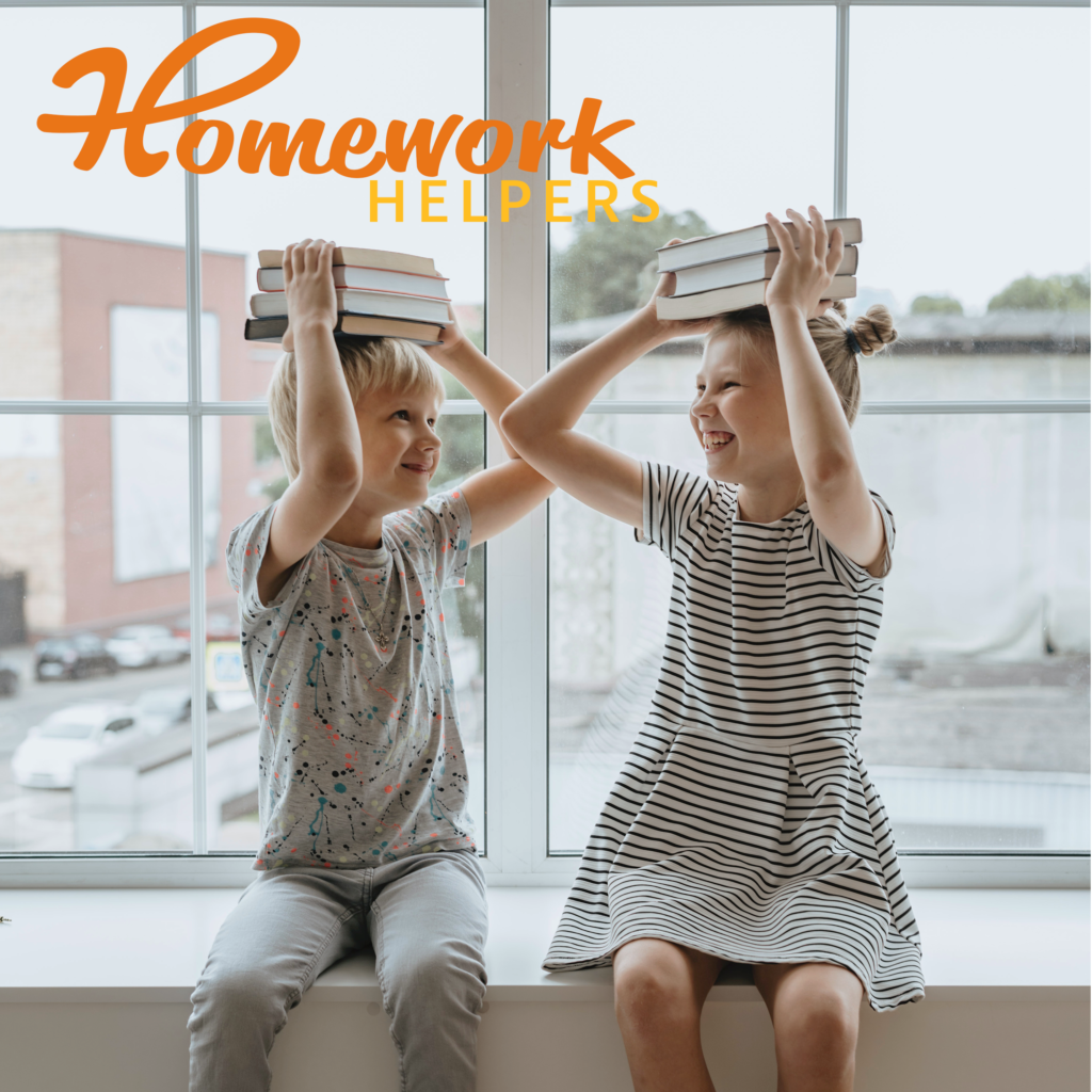 a boy and a girl holding books on top of their head while smiling